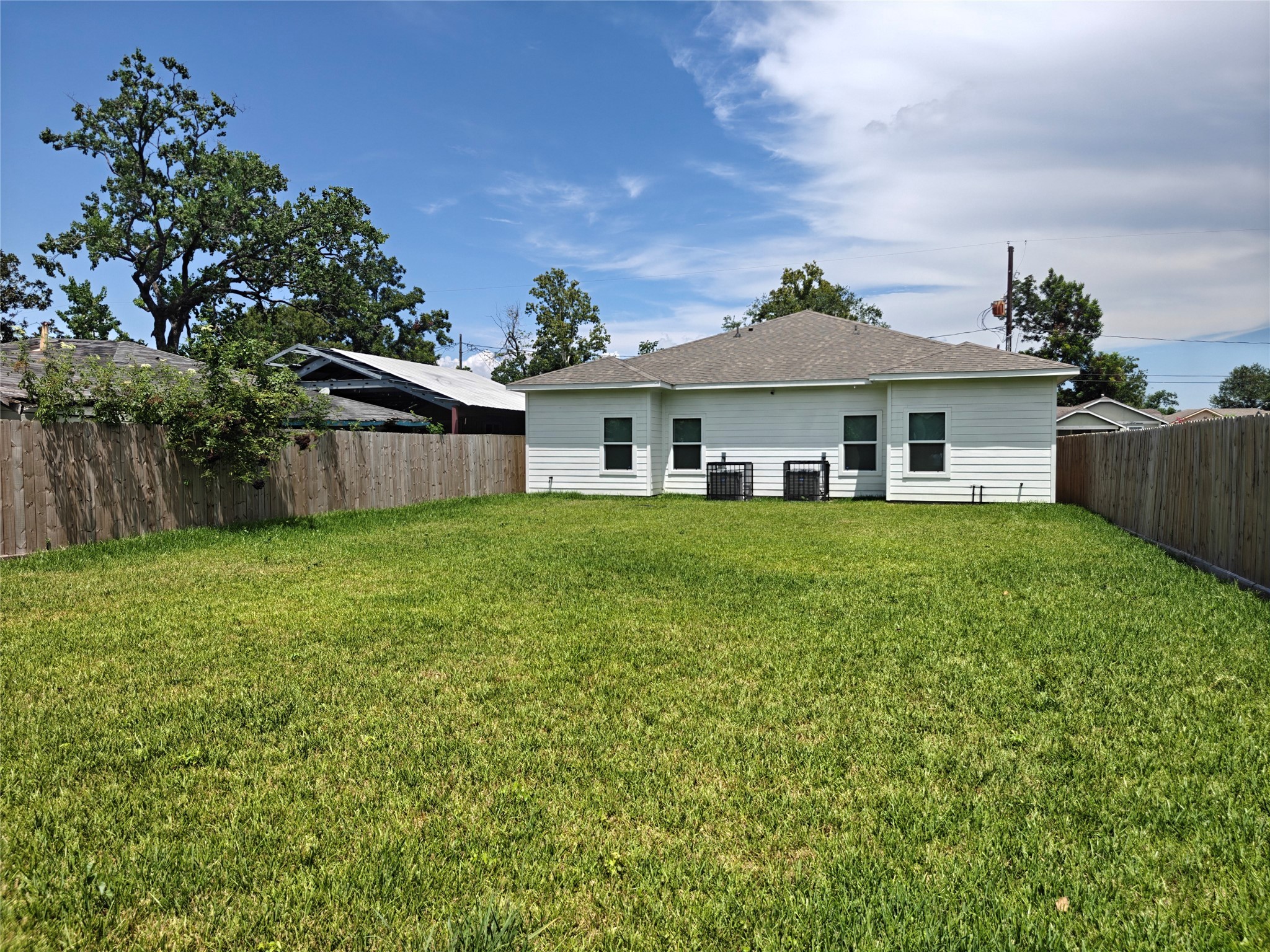 4124 Vaughn Street, Unit B Houston, TX 77016 - Photo 17 of 19 a front view of a house with a garden