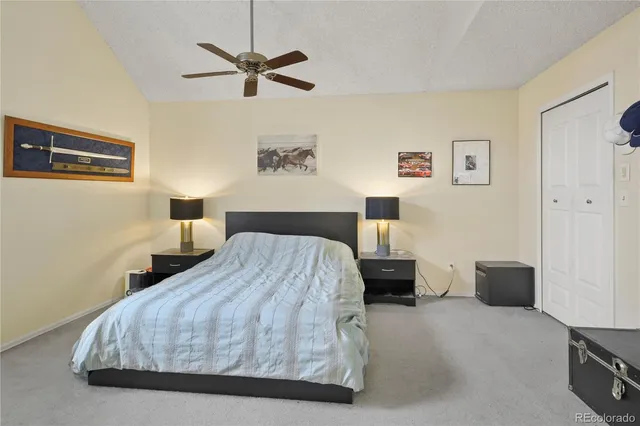 a bedroom with a bed and a cabinets