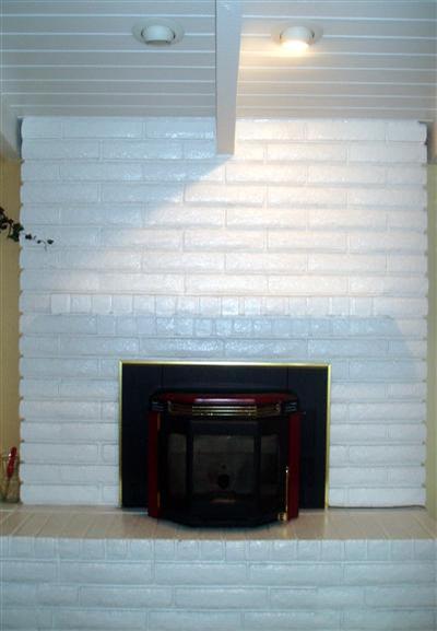 10580 Millerton Road Clovis, CA 93619 - Photo 18 of 45 Pellet Stove Insert in Formal Living Room. Stove has White Panels available for Front Siding. Can change from Red to White.