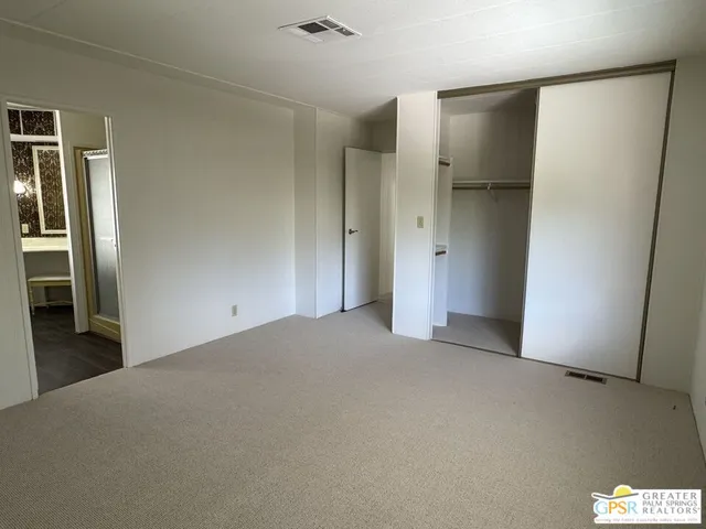 a en suite bathroom with a sink and a mirror