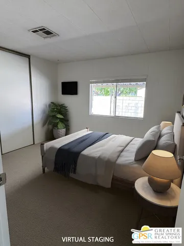 a bathroom with a sink a toilet a mirror and shower