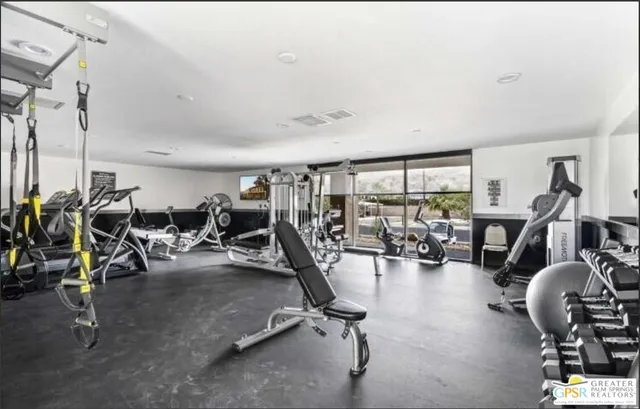 a room with furniture and flat screen tv