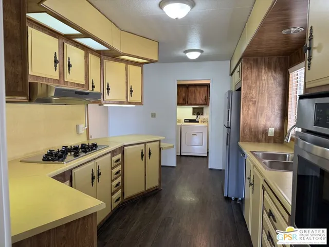 a view of kitchen with furniture and a window