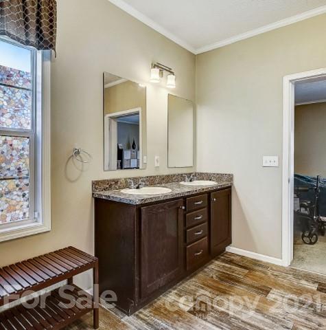 4910 Huntington Farm Road Catawba, SC 29704 - Photo 12 of 20 a bathroom with a granite countertop sink and a mirror