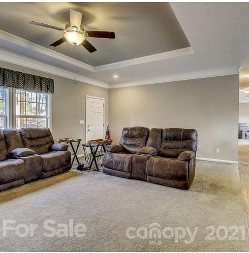 4910 Huntington Farm Road Catawba, SC 29704 - Photo 3 of 20 a living room with furniture and a ceiling fan