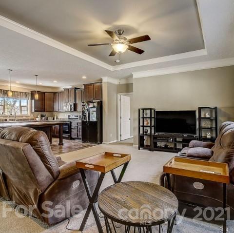 4910 Huntington Farm Road Catawba, SC 29704 - Photo 5 of 20 a living room with furniture kitchen view and a flat screen tv