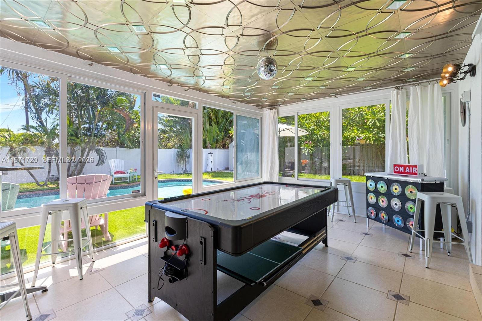 2770 Northeast 30th Street Lighthouse Point, FL 33064 - Photo 22 of 27 a view of a dining room with furniture window and outside view