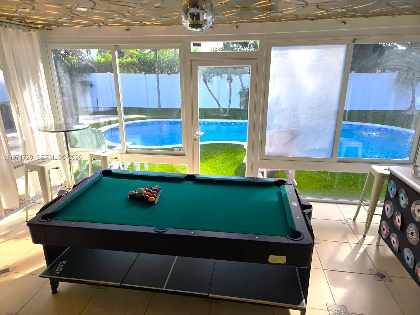 2770 Northeast 30th Street Lighthouse Point, FL 33064 - Photo 23 of 27 a room with pool table and windows
