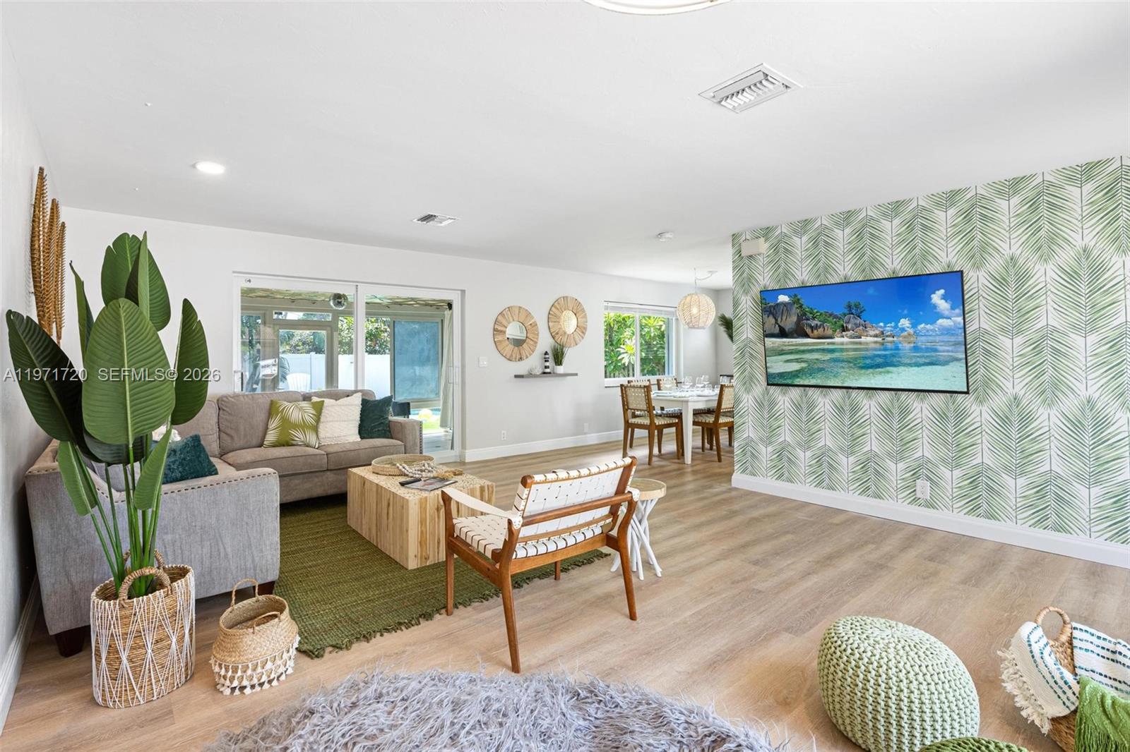 2770 Northeast 30th Street Lighthouse Point, FL 33064 - Photo 5 of 27 a living room with furniture and a wooden floor