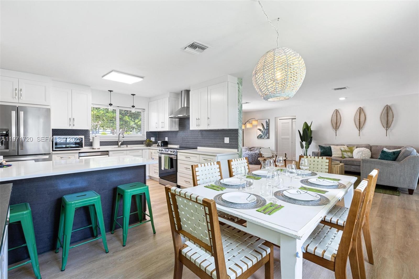 2770 Northeast 30th Street Lighthouse Point, FL 33064 - Photo 10 of 27 a large kitchen with a table and chairs
