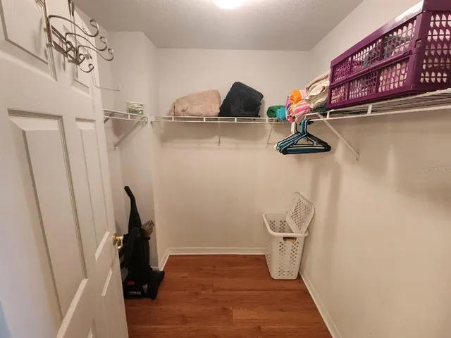 a view of storage and utility room with racks on the wall