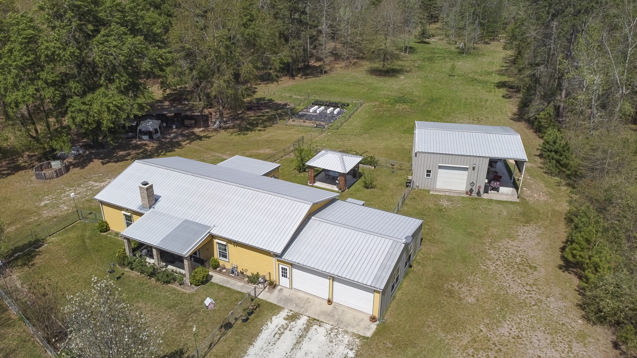 an aerial view of a house with outdoor space