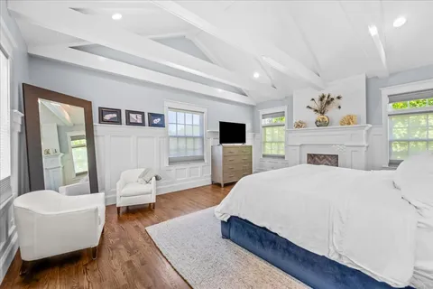 a spacious bedroom with a bed and a couch