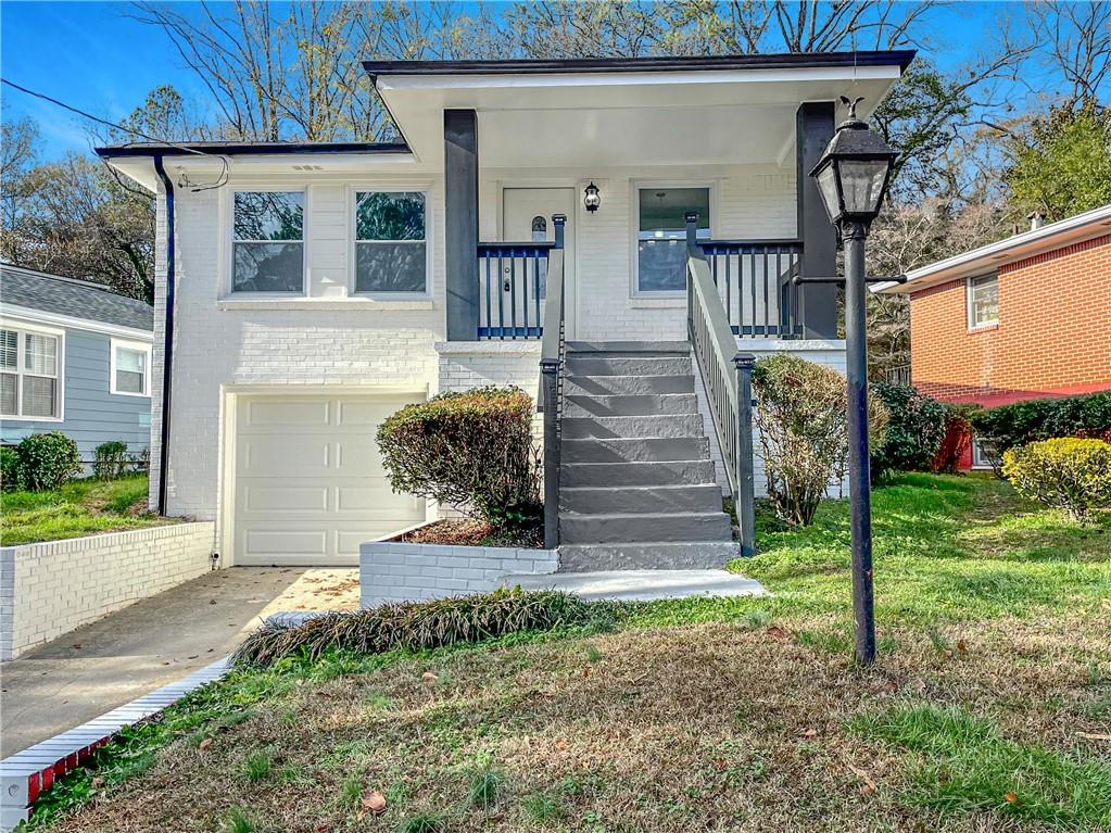 296 Hemphill School Road Northwest Atlanta, GA 30331 - Photo 1 of 1 a front view of a house with a yard