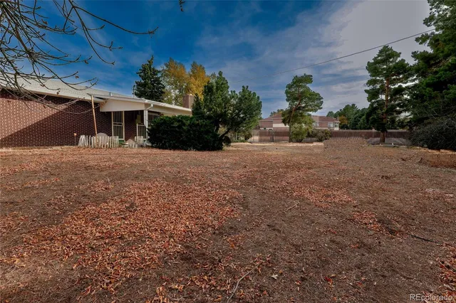 a front view of a house with a yard and a garage