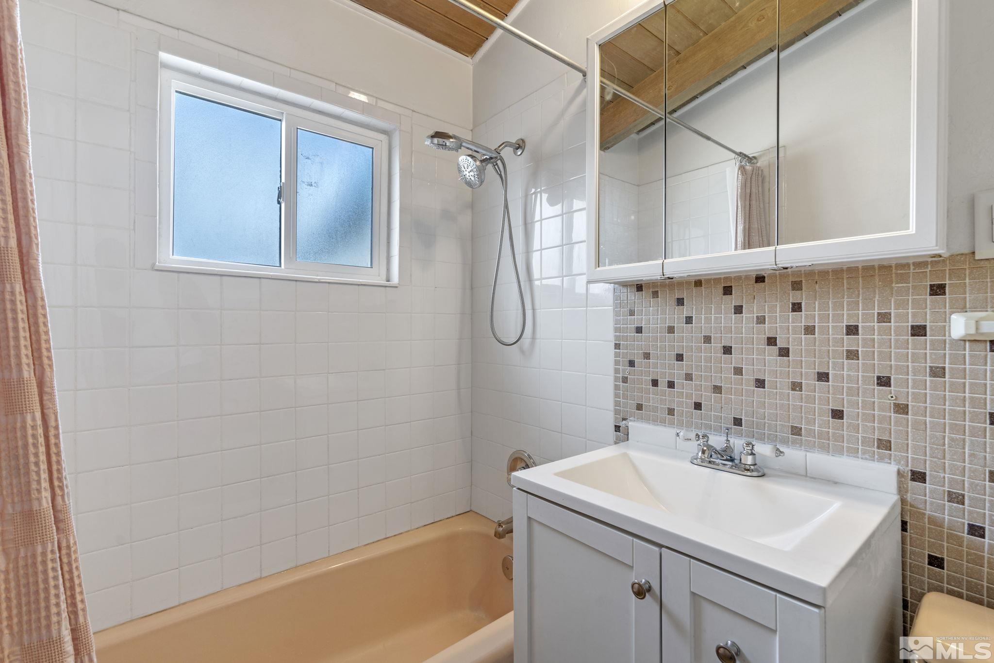 320 M Street Sparks, NV 89431 - Photo 24 of 32 a bathroom with a sink a toilet and shower