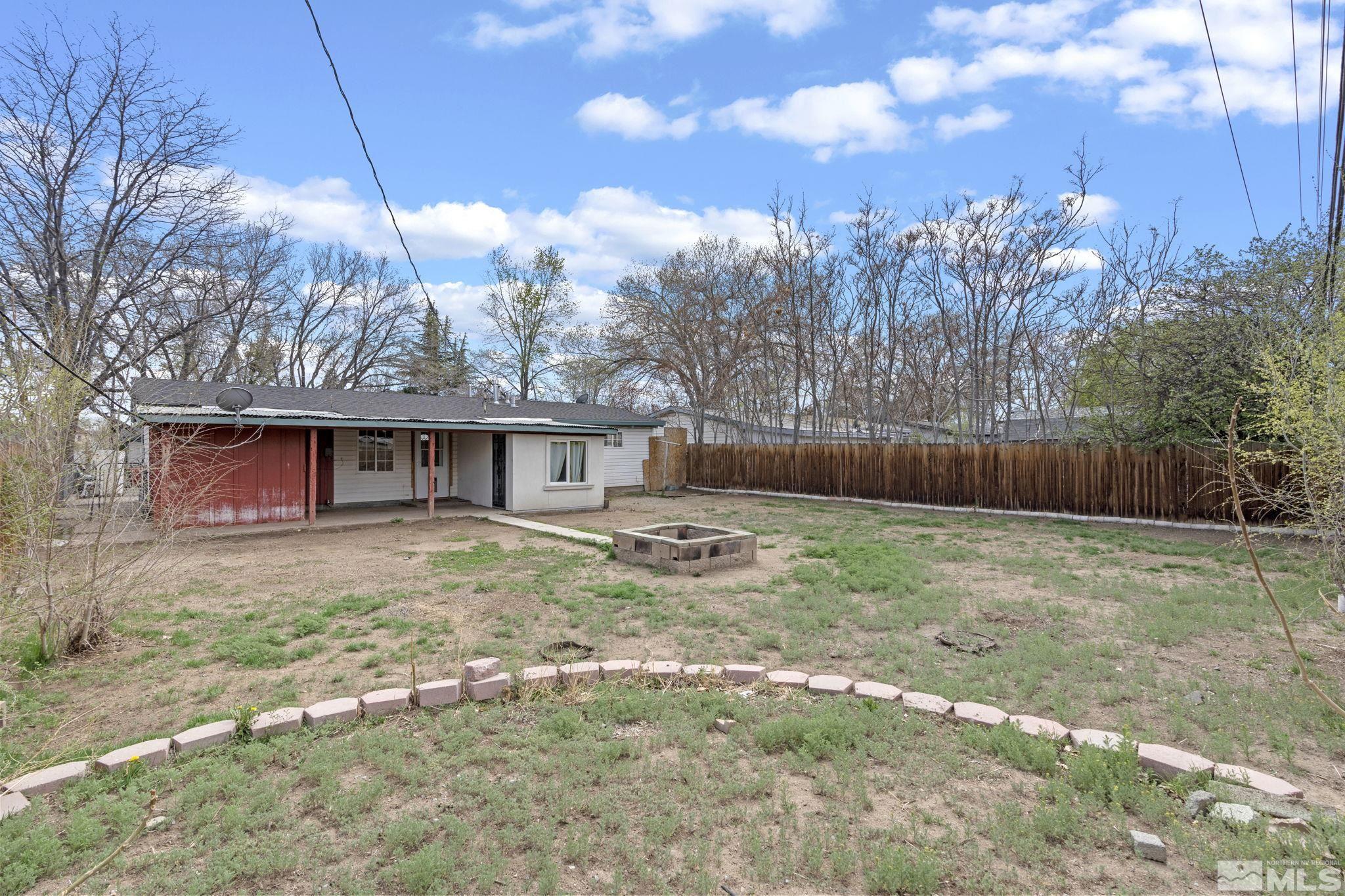 320 M Street Sparks, NV 89431 - Photo 30 of 32 a view of a house with backyard and trees