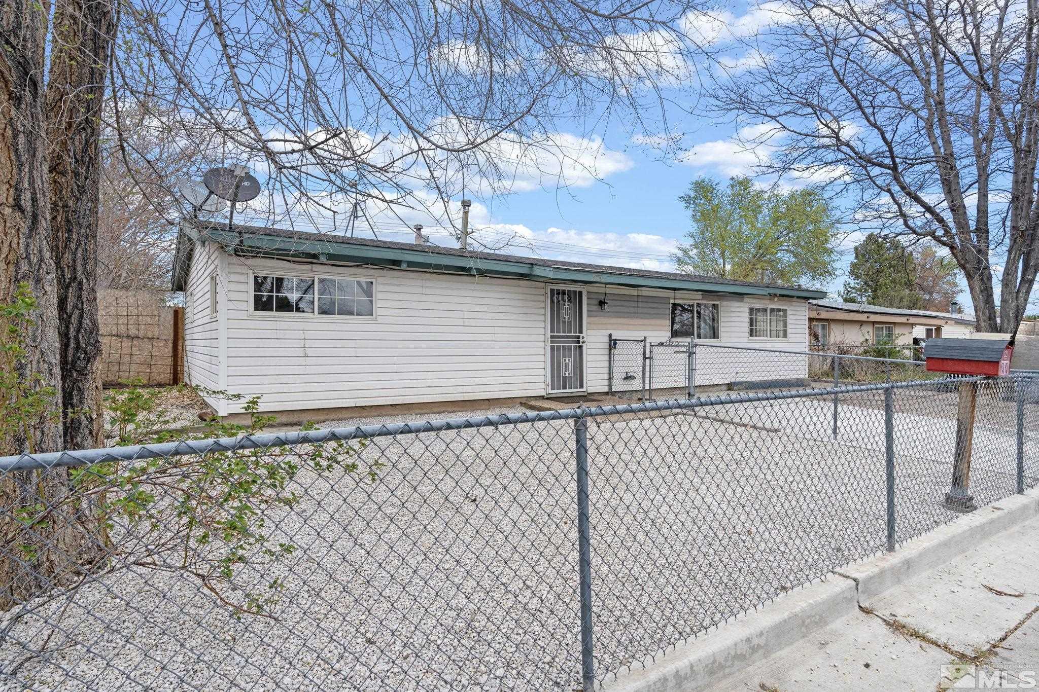 320 M Street Sparks, NV 89431 - Photo 3 of 32 a white house that has tree in front of it