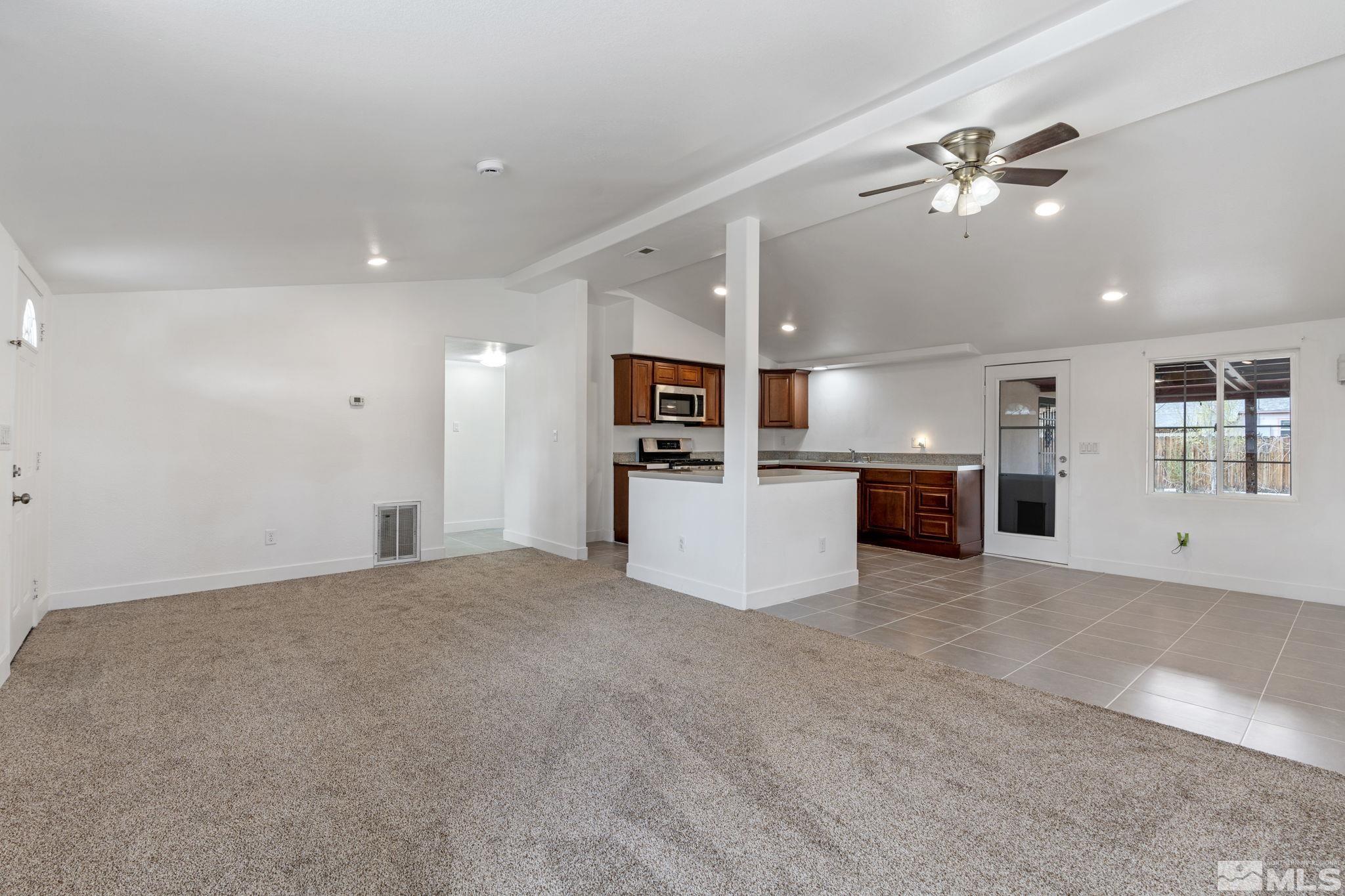 320 M Street Sparks, NV 89431 - Photo 8 of 32 a view of a kitchen with a sink and a microwave
