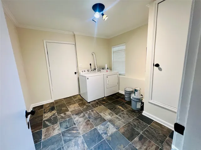 a room with a baby crib and a window