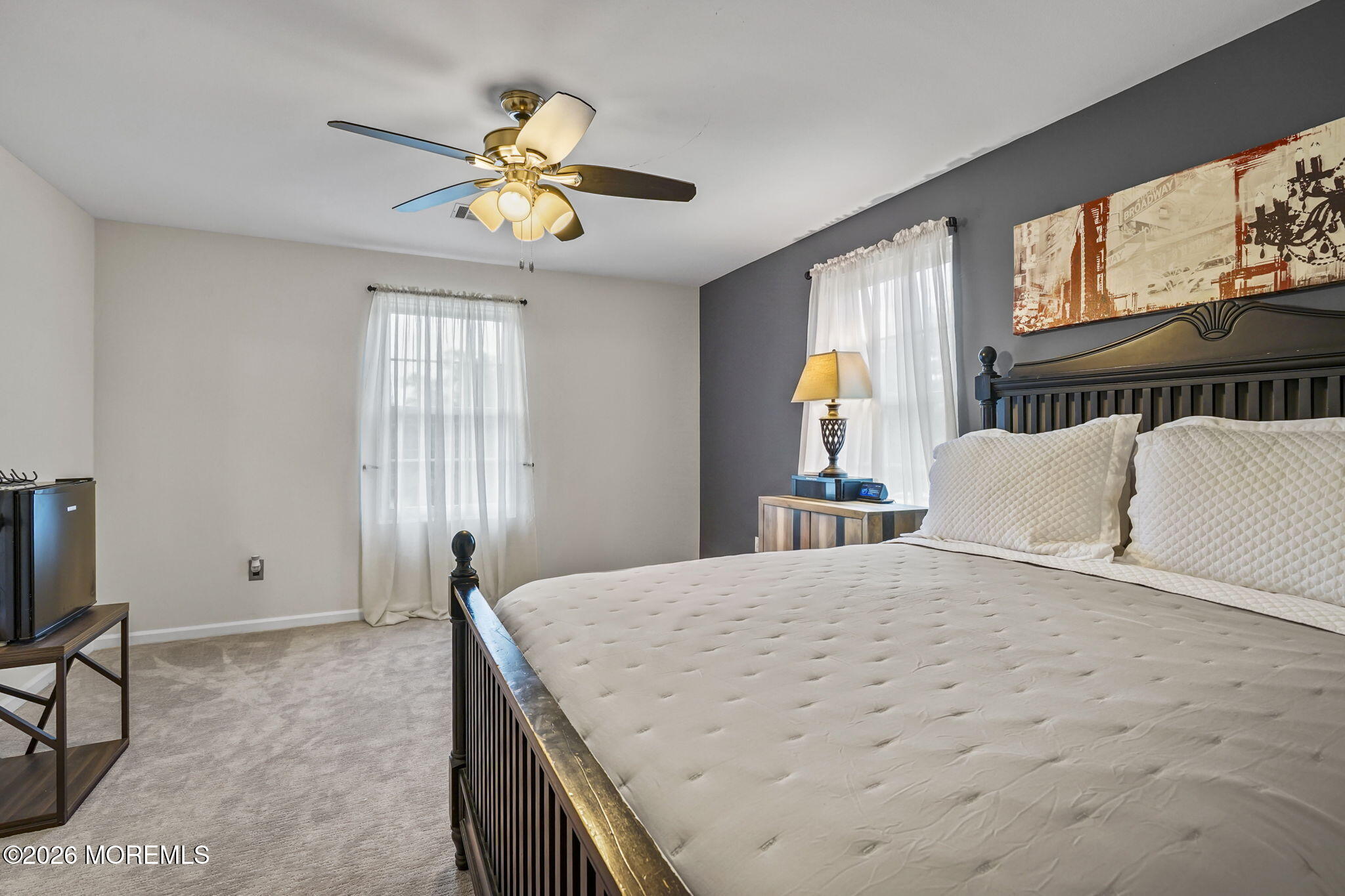 438 Bennetts Mills Road Jackson, NJ 08527 - Photo 22 of 42 a bedroom with a bed and a chandelier
