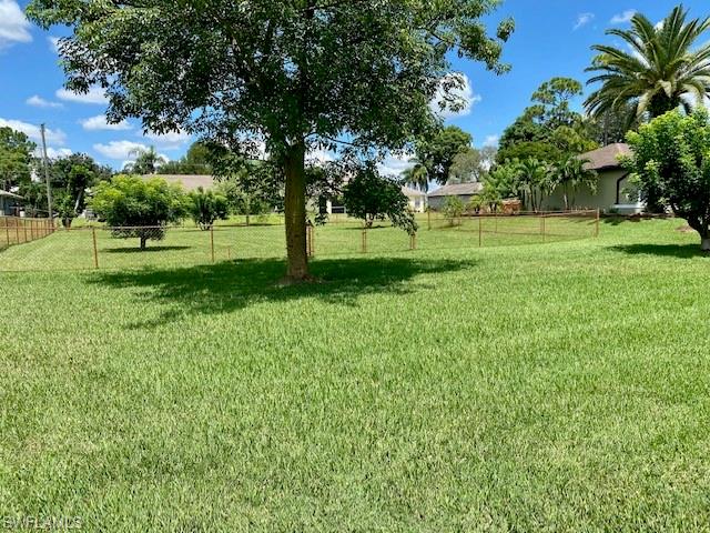 9099 Morris Road Fort Myers, FL 33967 - Photo 3 of 5 a huge green field with lots of trees