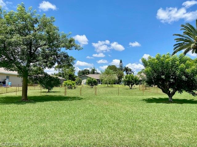 9099 Morris Road Fort Myers, FL 33967 - Photo 4 of 5 a view of grassy field with trees