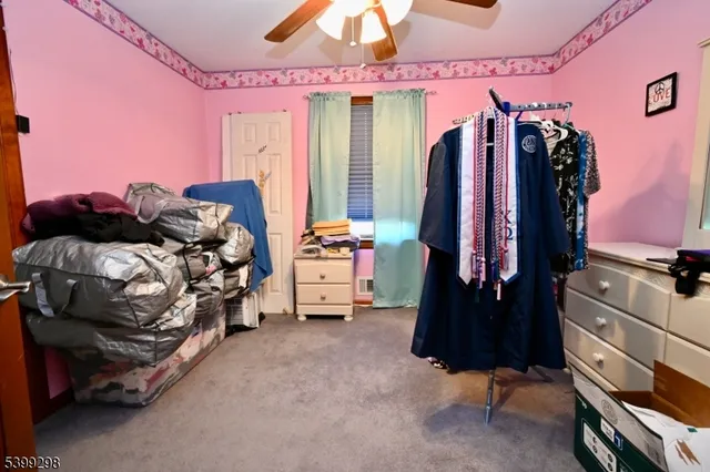 a bedroom with a bed and a closet