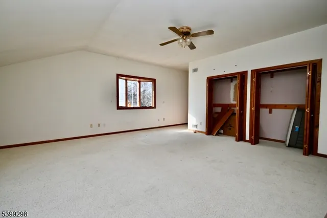 a view of empty room with windows