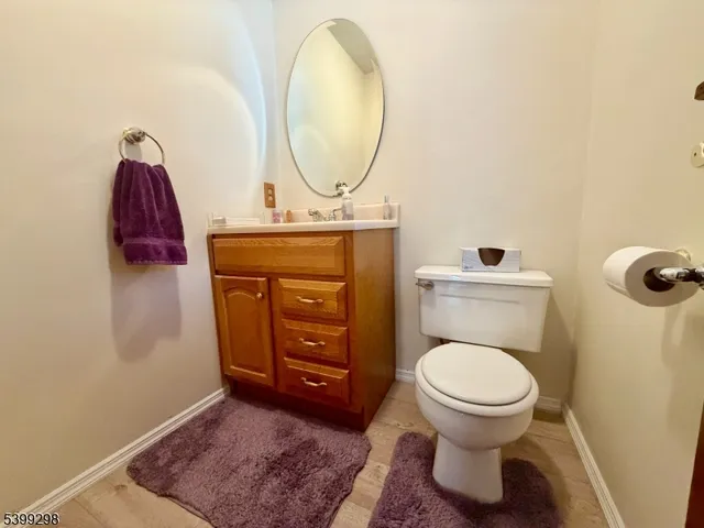 a bathroom with a toilet and a mirror