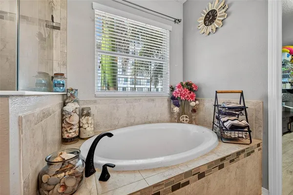 a white bath tub sitting next to a window