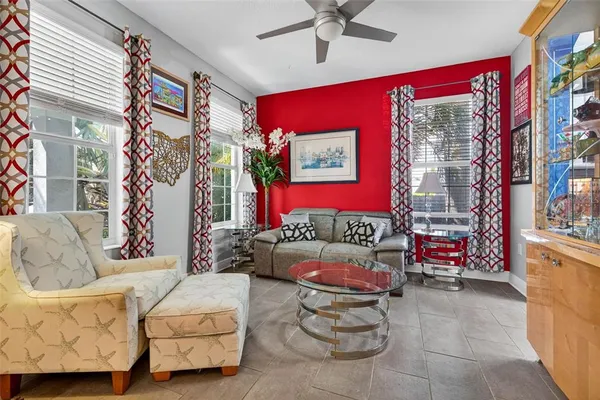 a living room with furniture and a potted plant