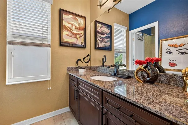 a bathroom with a sink double vanity and a window