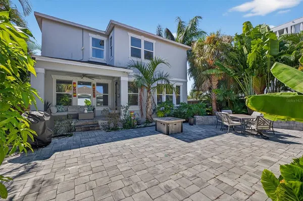 a view of house with patio outdoor seating and entertaining space