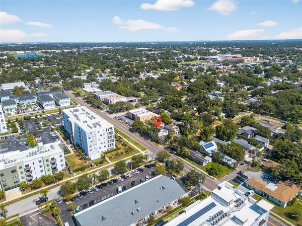 an aerial view of residential houses with outdoor space