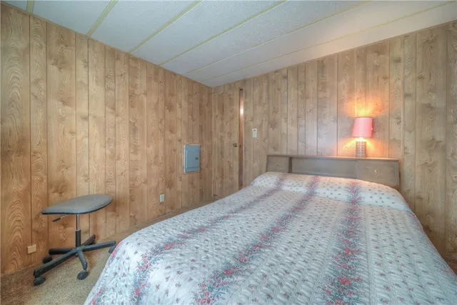 a bedroom with a bed and a table