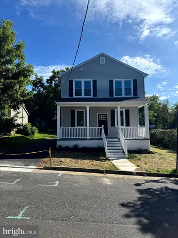 a kitchen with stainless steel appliances granite countertop a sink a stove top oven a counter space and cabinets