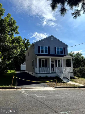 a kitchen with granite countertop a sink a stove and cabinets
