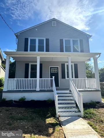 a kitchen with granite countertop a sink granite counter tops and a wooden floors