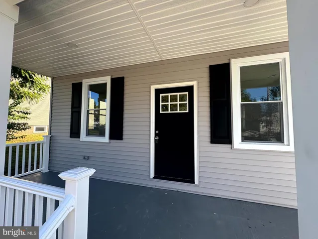 a view of empty room with wooden walls
