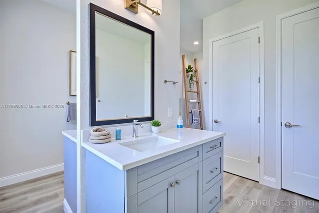 a bathroom with a sink and a mirror