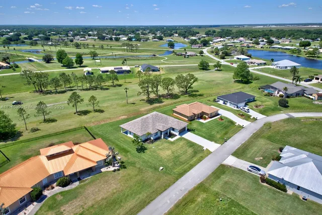 an aerial view of a house with a garden