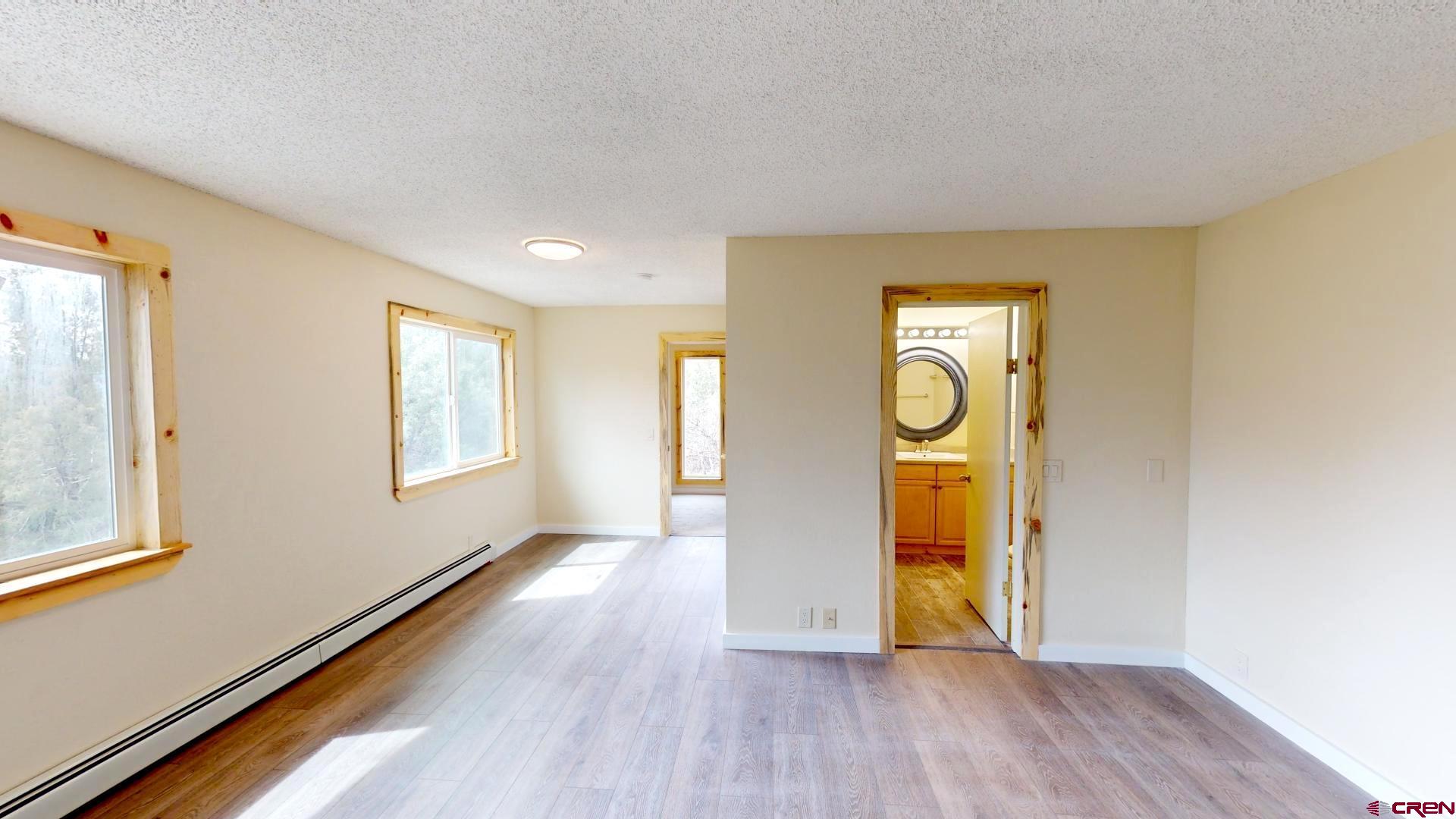 356 County Road 201 Durango, CO 81301 - Photo 17 of 35 a view of an empty room with window and wooden floor