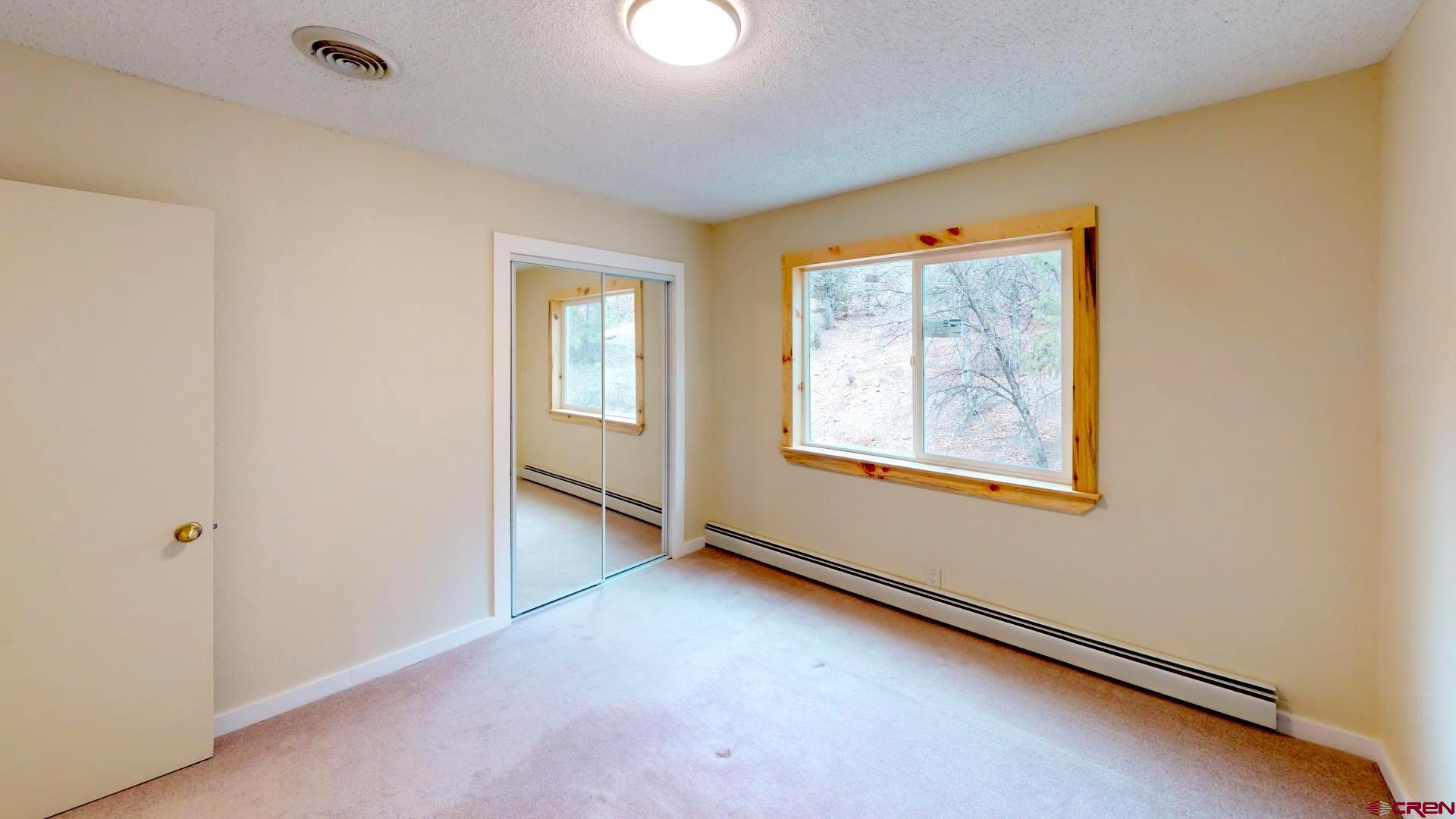356 County Road 201 Durango, CO 81301 - Photo 22 of 35 an empty room with windows
