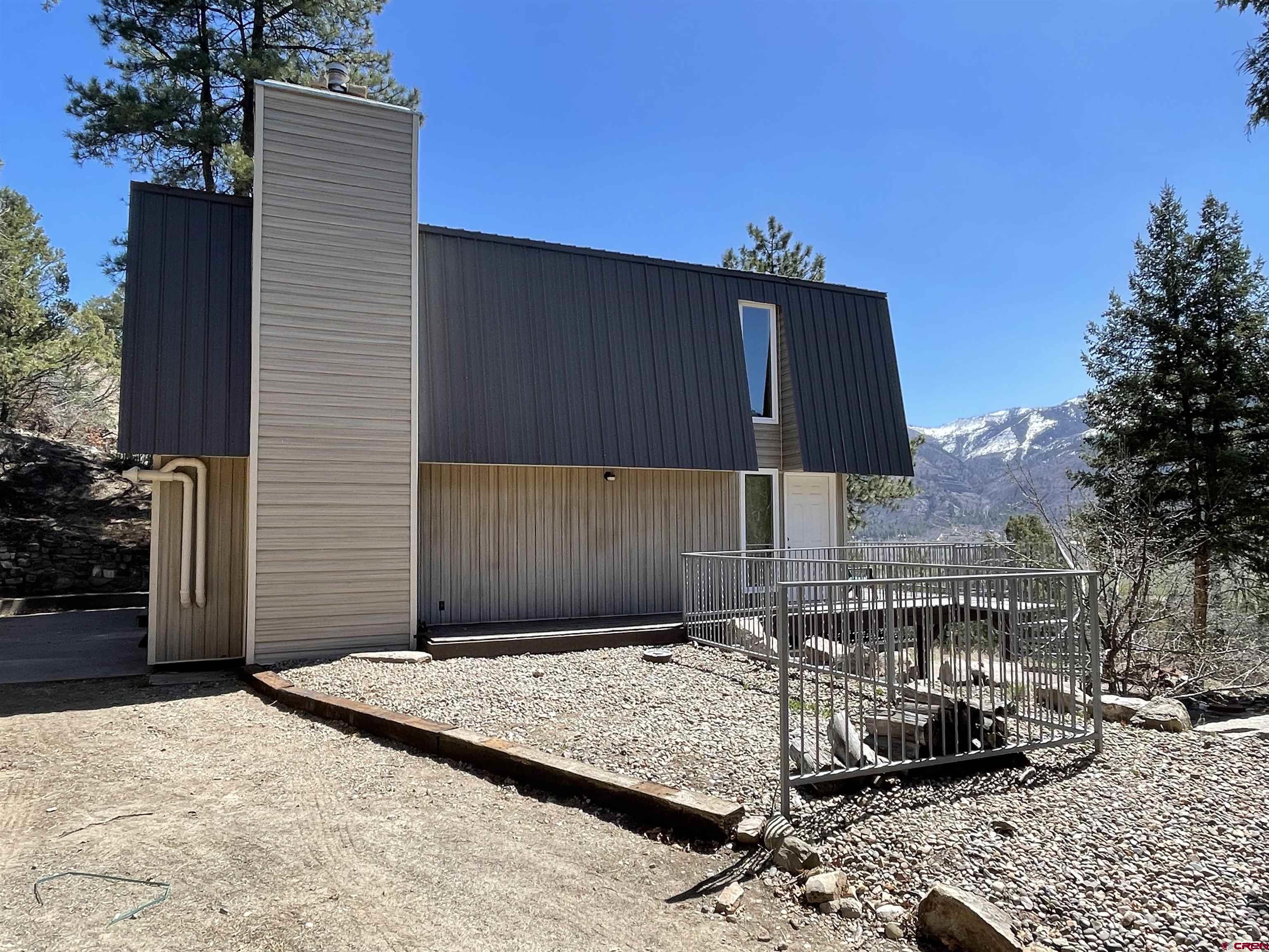 356 County Road 201 Durango, CO 81301 - Photo 24 of 35 a front view of a house with a yard