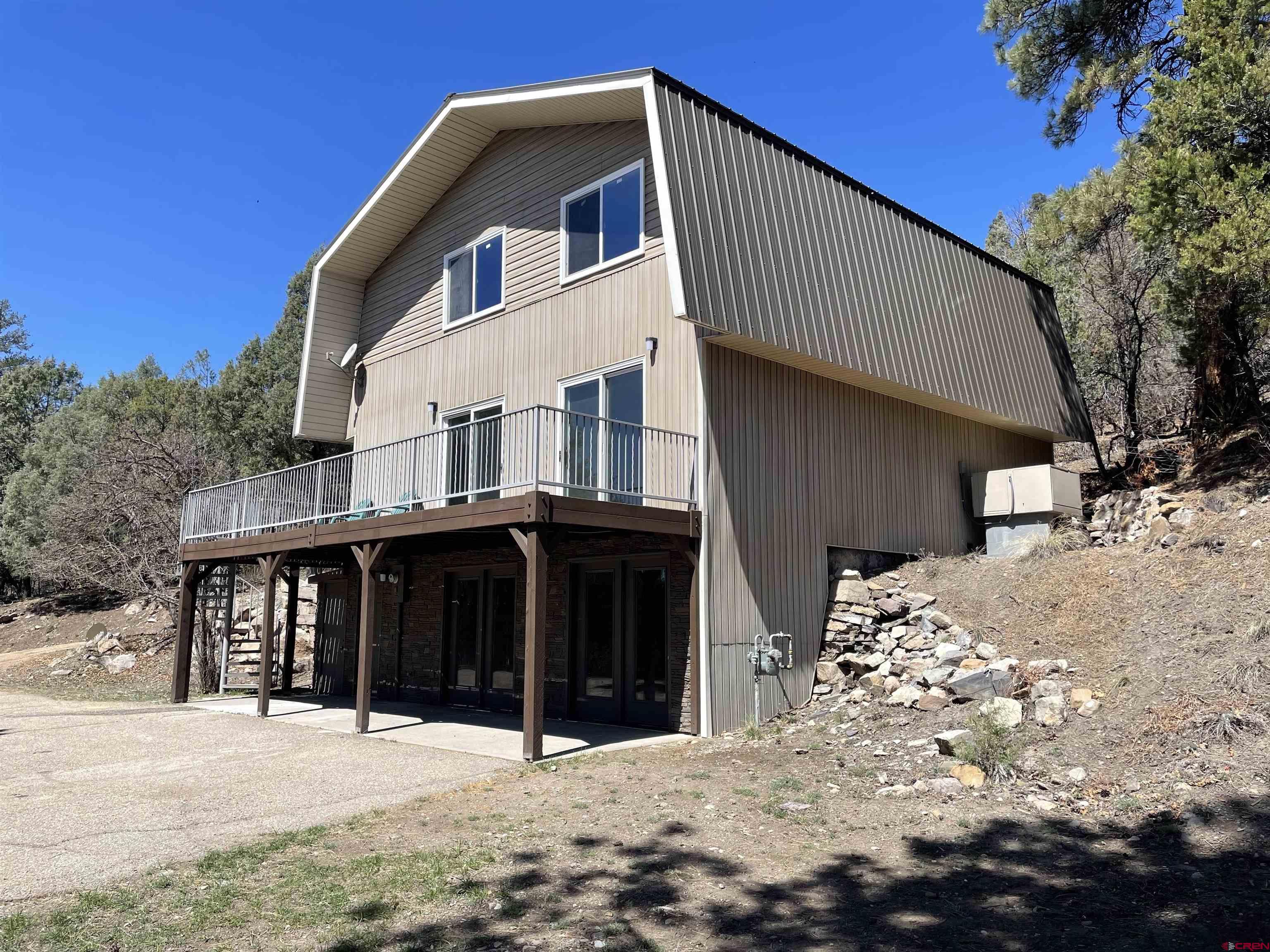 356 County Road 201 Durango, CO 81301 - Photo 27 of 35 a front view of a house with a yard