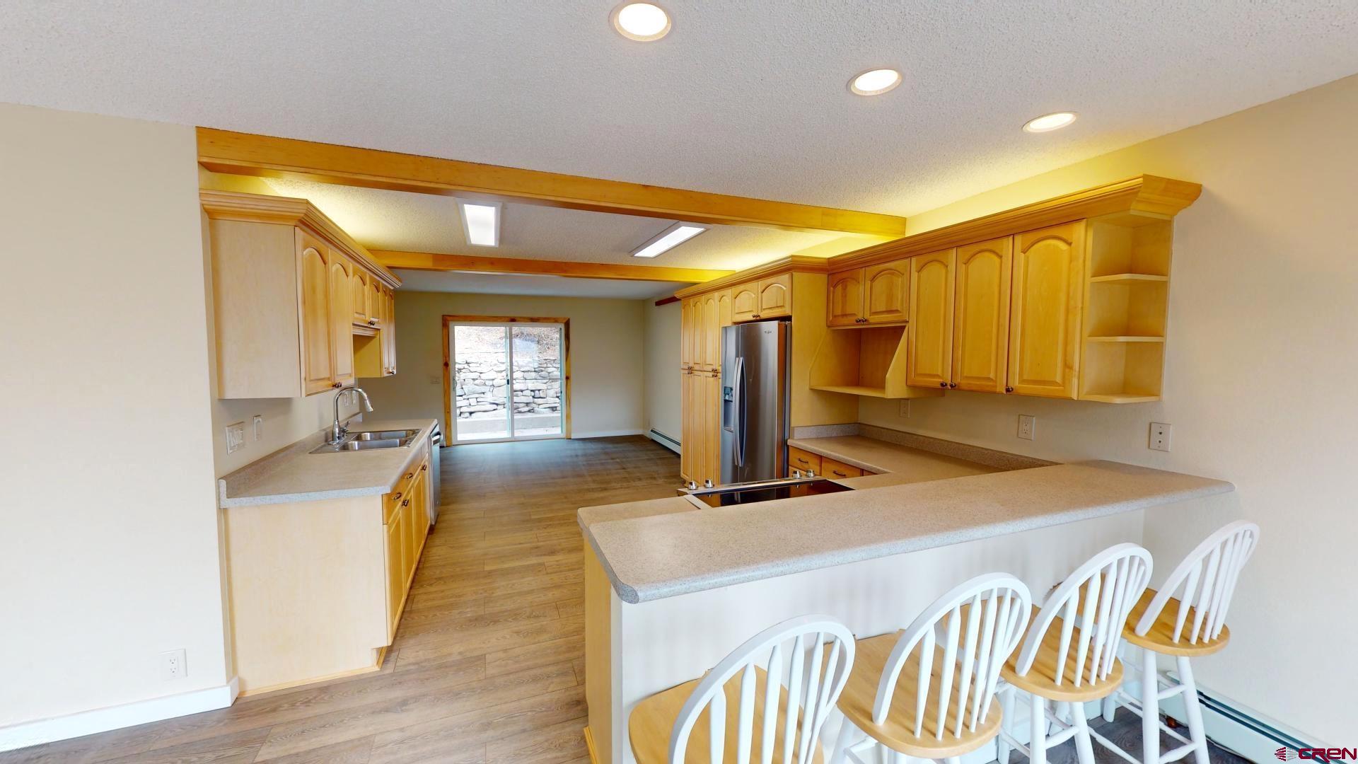 356 County Road 201 Durango, CO 81301 - Photo 8 of 35 a spacious bathroom with a granite countertop sink and a mirror