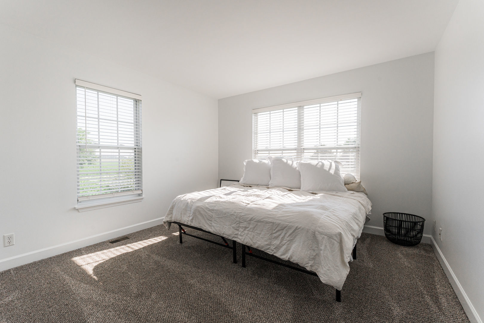 2117 Frantum Road Sycamore, IL 60178 - Photo 12 of 24 a bedroom with a bed lamp and a window