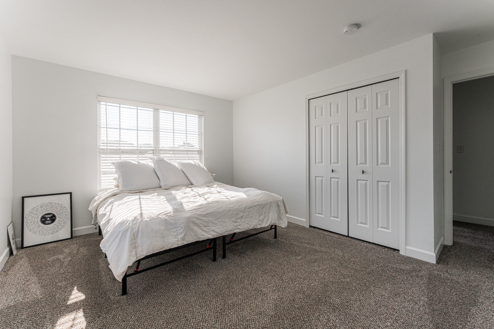 2117 Frantum Road Sycamore, IL 60178 - Photo 13 of 24 a bed sitting in a bedroom next to a window