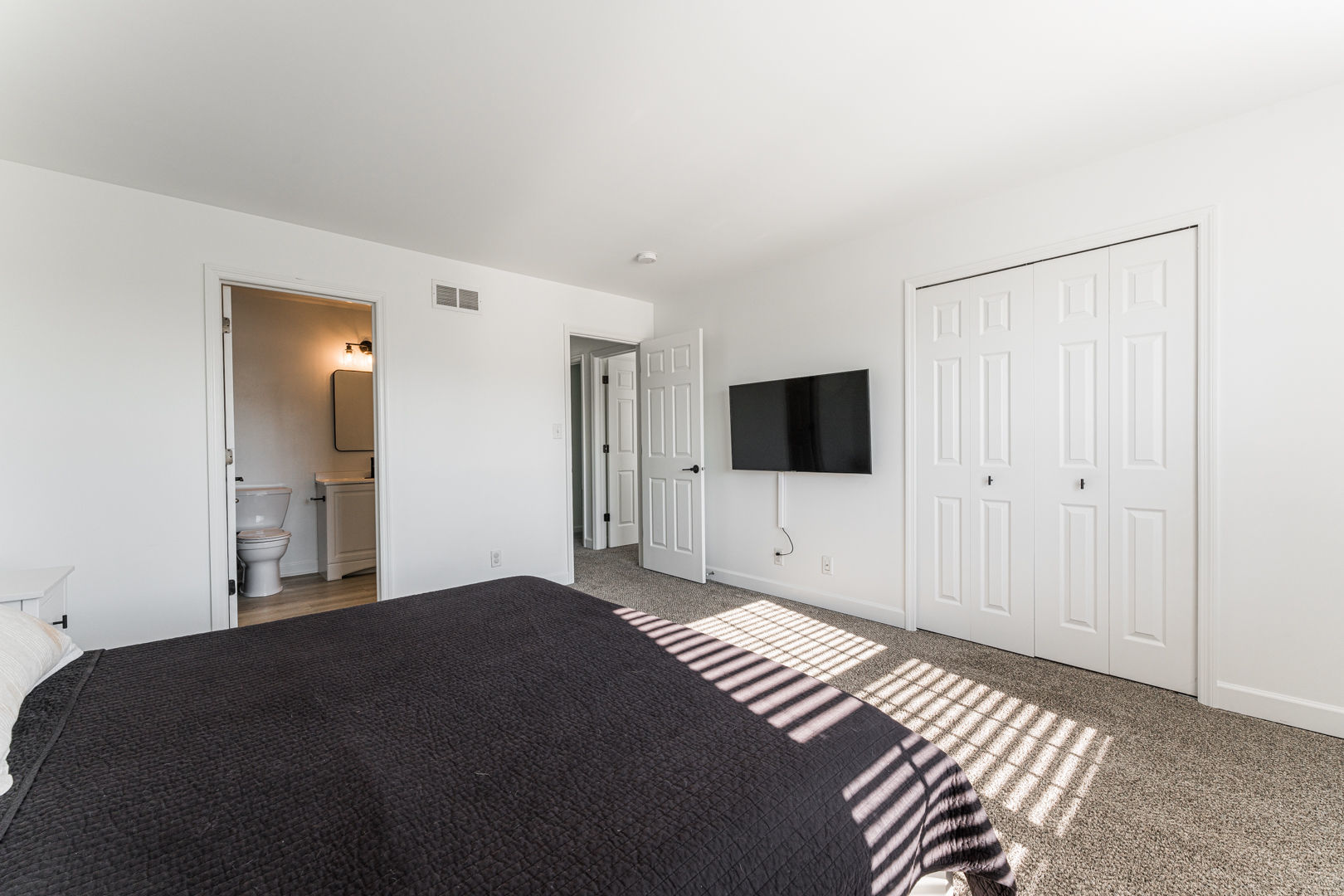2117 Frantum Road Sycamore, IL 60178 - Photo 15 of 24 a bedroom with a bed and a flat screen tv